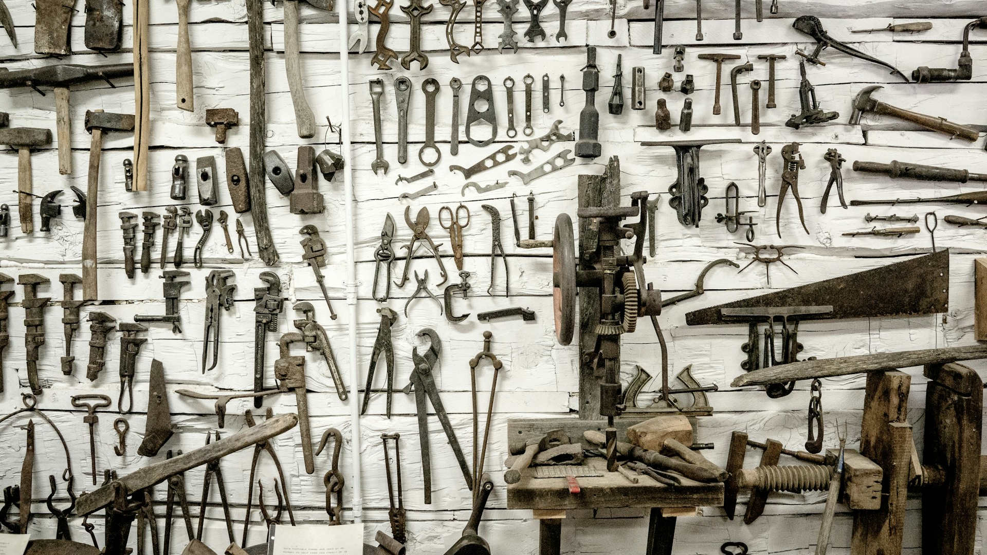 Classic tools on a white wall