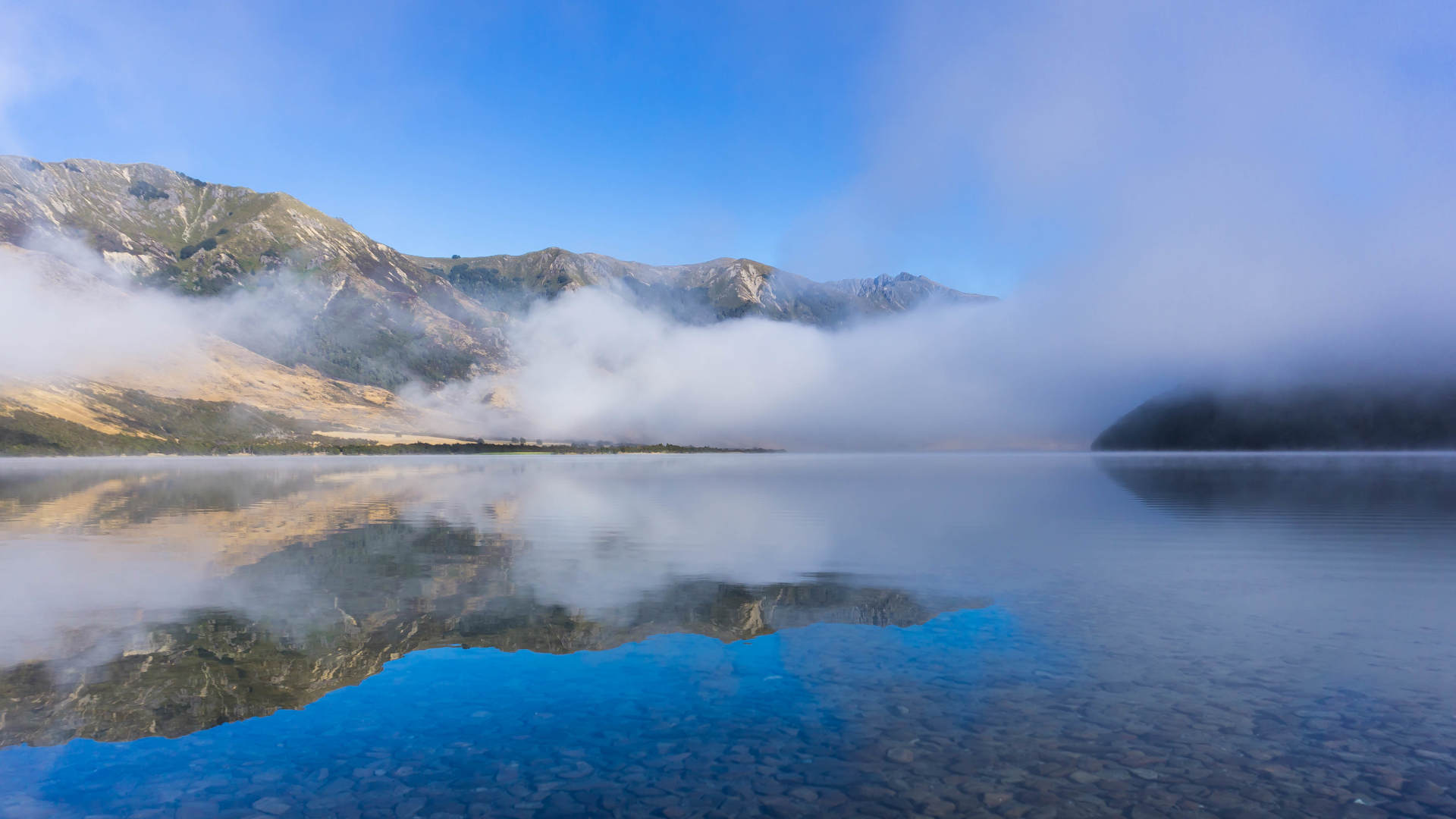 Clouds above a lake, early in the morning