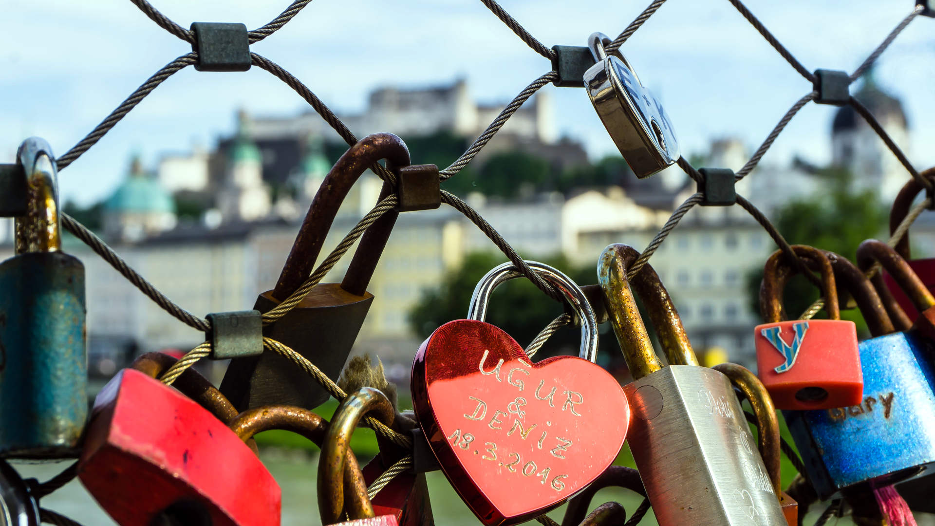 Lots of locks attached to a fence in Austria